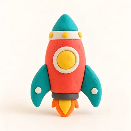 A coral and teal clay rocket, made by a child